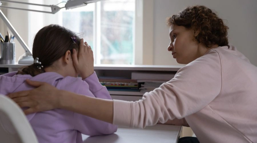 Image of mother consoling teen daughter -Conversation with Kids