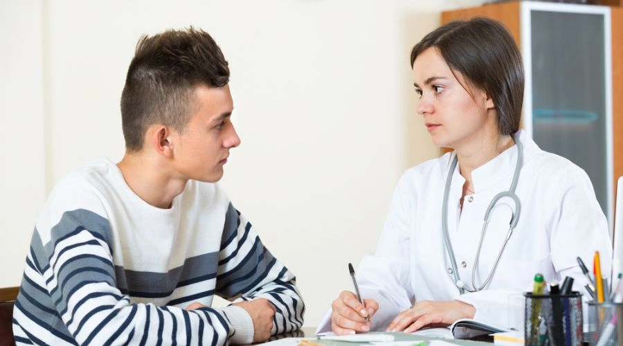 Image of a teen talking to his counselor - Dual Diagnosis for Mental Health