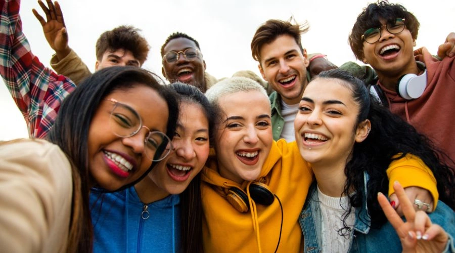 Group of multiracial teenagers smiling and  having fun outdoors