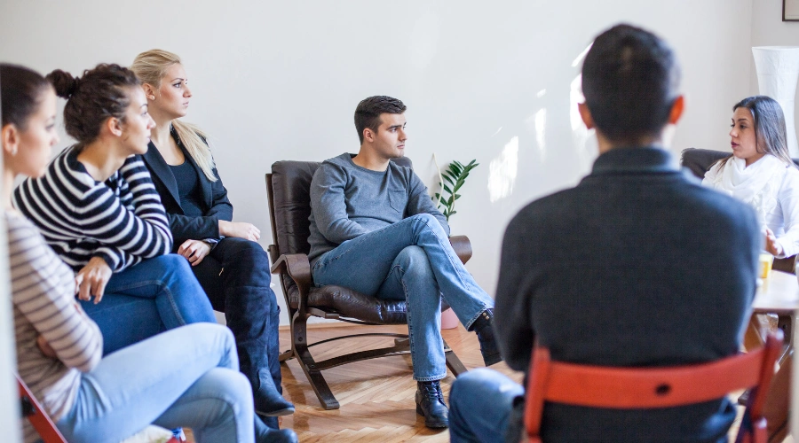 Teen participating in an aftercare support group as part of a Xanax addiction recovery program