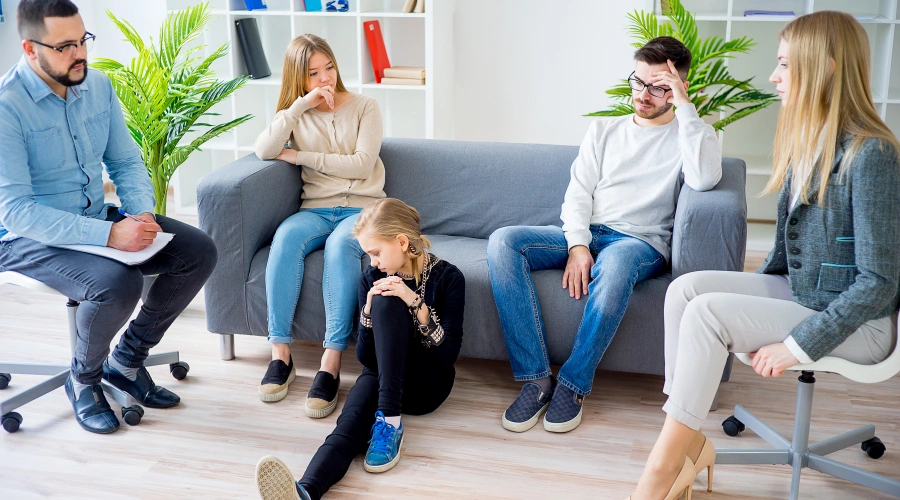 Image of a family in therapy with their teen daughters - Functional Family Therapy (FFT) - Artemis Adolescent Healing Center