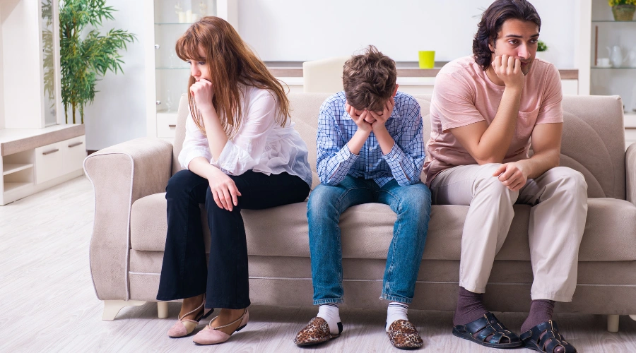 Image of a stressed parent looking worried while thinking about whether boarding school is the right choice for their struggling teen