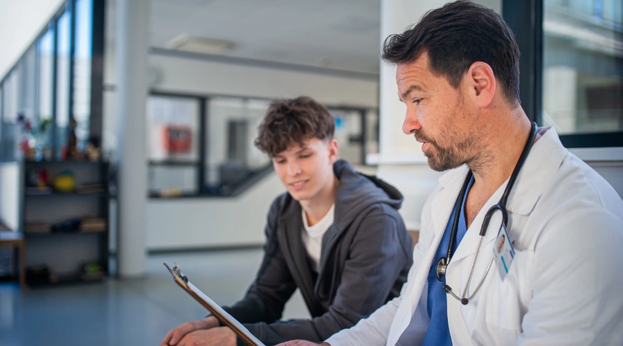 Image of a teen meeting with a clinician to discuss withdrawal and detox needs