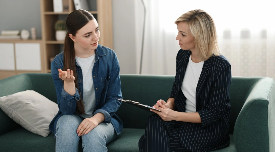 Image of a therapist meeting with a teen to create a personalized treatment plan, highlighting individualized care in MST programs