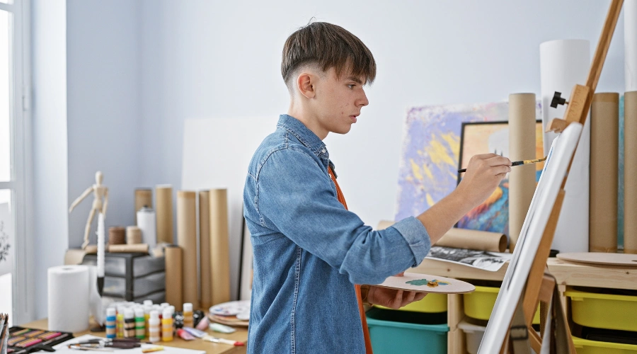 Image of a male teen expressing emotions through art