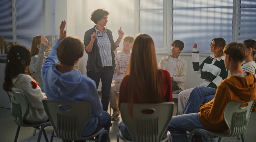 Image of a teen group therapy session being led by a female counselor - Problem-Solving Activities for Teens in Recovery - Artemis Adolescent Healing Center
