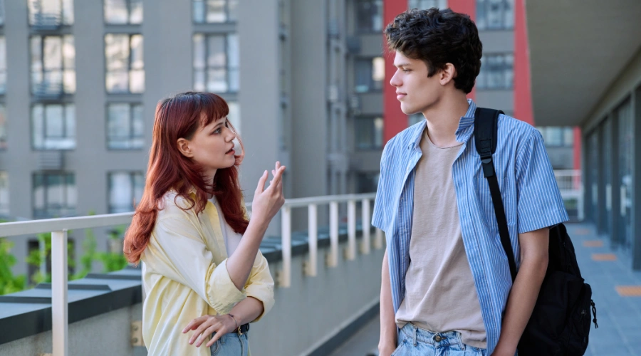 Image of two teenage friends talking, representing how teens discuss mental health and slang terms with each other