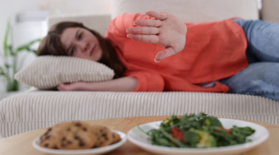 Image of a teenager displaying warning signs of eating disorder behaviors