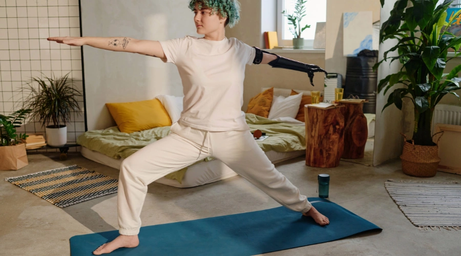 Image of a teenager engaging in mindful movement activities like yoga for emotional wellness