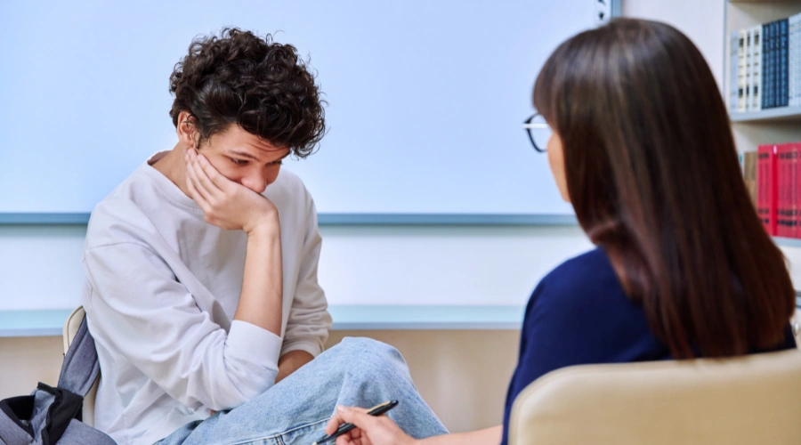 Image of a teenager participating in therapy for defiant behavior