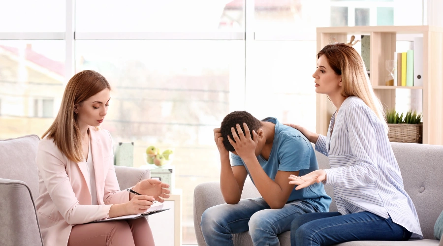 Image of parent seeking professional help for teen showing warning signs of passive aggressive behavior and emotional distress
