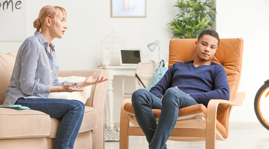 Image of teen receiving inpatient depression treatment during a supervised individual therapy session