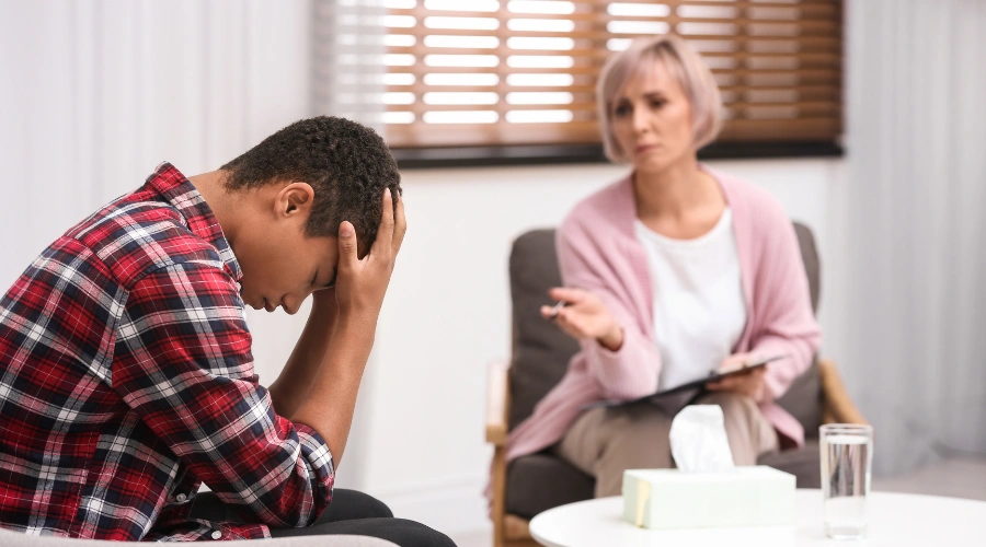 Image of a clinician assessing co-occurring conditions and dual diagnoses in a teenager with antisocial personality disorder