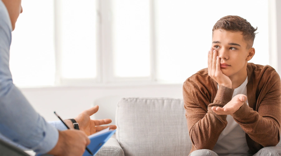 Image of a teenager receiving professional treatment for mental health conditions at an adolescent healing center