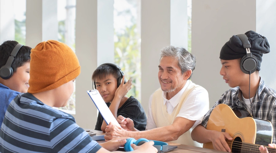 Image of a diverse group of teens engaging in music therapy for emotional and behavioral support