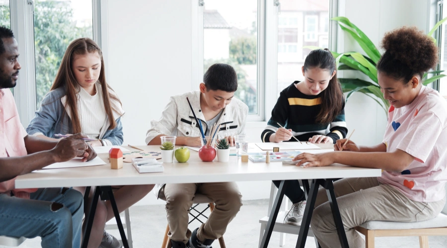 Image of a teen participating in an outpatient art therapy session as part of a long-term treatment program