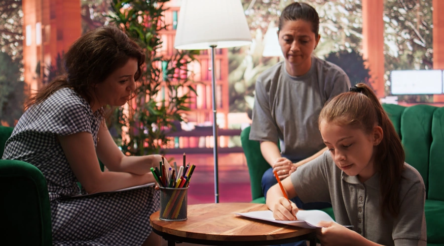 Image of a teenager focused on creating art as a mindfulness and grounding practice during therapy